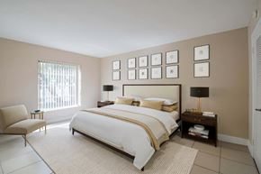 Kendall apartment for rent - a bedroom with a bed and pictures on the wall