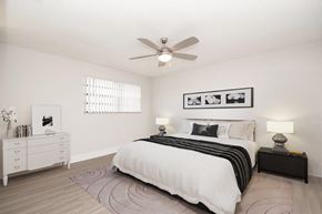 Miami apartment for rent - a bedroom with a bed and a ceiling fan