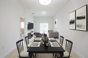 Hialeah Gardens apartment for rent - a dining room with a black table and chairs