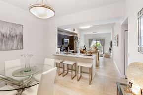 Hialeah apartment for rent - a dining room and kitchen area with a glass table and chairs