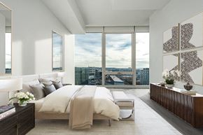 Washington apartment for rent - a bedroom with a bed and a view of the city