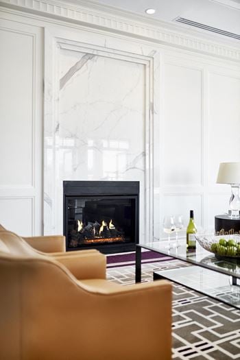 Fully appointed resident lounge with a stately fireplace