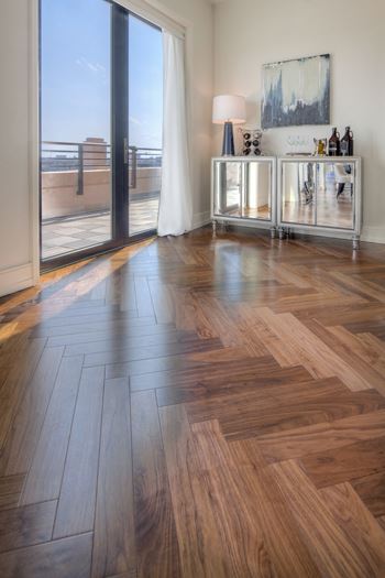 Walnut hardwood flooring in a distinctive chevron pattern available