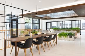 Arlington apartment for rent - a large dining room with a long wooden table and chairs