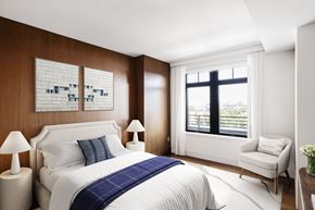 Washington apartment for rent - a bedroom with a bed and a window