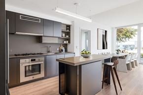 Washington apartment for rent - a kitchen and dining area with stainless steel appliances and a counter top