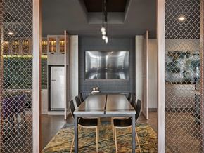 Washington apartment for rent - a dining room with a table and chairs and a television