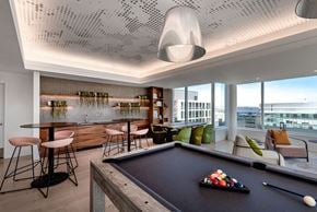 Washington apartment for rent - a game room with a pool table and a bar