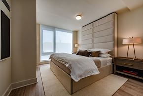 Washington apartment for rent - the master bedroom has a large bed and a large window