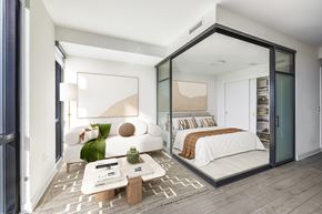 Washington apartment for rent - a bedroom with a large bed and a large window