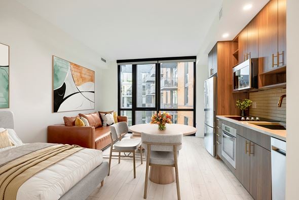 Washington apartment for rent - a bedroom with a bed and a table in a room