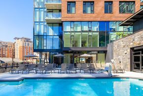 Bethesda apartment for rent - a swimming pool in front of a building
