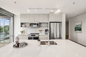 Washington apartment for rent - a kitchen with white counter tops and a sink