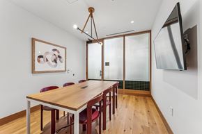 Arlington apartment for rent - A dining room with a wooden table and chairs.