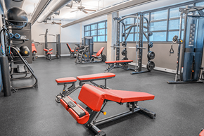 Washington apartment for rent - A gym with a variety of equipment including weights and benches.