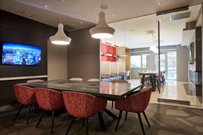 Washington apartment for rent - a dining room with a table and chairs and a television