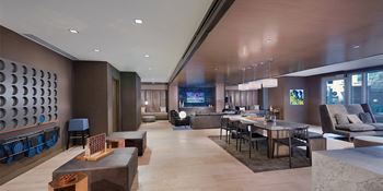 Resident lounge with chef’s kitchen, coffee bar, tvs and computers