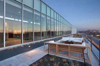 Rooftop living rooms with grills and kitchenettes