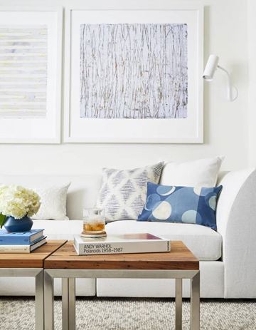 Washington apartment for rent - A book titled "Andy Warhol Polaroids 1958-1967" is on a coffee table in a living room.