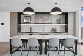 Arlington apartment for rent - A modern dining room with a large table and grey chairs.