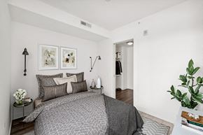 Washington apartment for rent - a bedroom with a bed and two pictures on the wall