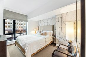 Arlington apartment for rent - a bedroom with a large bed and a large window