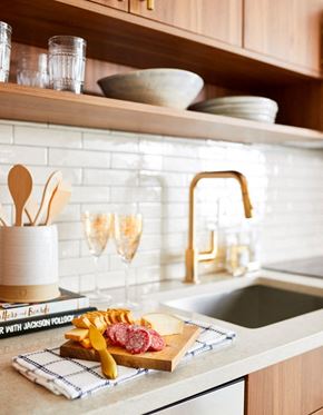 Washington apartment for rent - a kitchen sink with a cutting board with meat and cheese on it