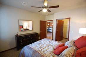 Madison apartment for rent - a bedroom with a large bed and a ceiling fan