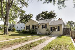 Denver apartment for rent - a white house with a sidewalk in front of it