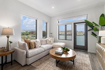 Boulder apartment for rent - A living room with a white sofa and a coffee table.