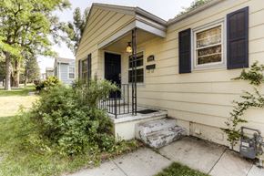 Denver apartment for rent - the front of a house with steps and a black door