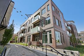 Boulder apartment for rent - A modern building with a glass entrance and a balcony.