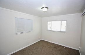 Denver apartment for rent - A room with a window and a carpeted floor.