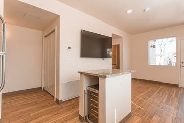 Boulder apartment for rent - a living room with a bar and a television