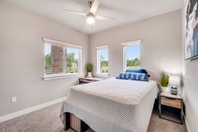 Fort Collins apartment for rent - A bedroom with a bed, nightstand, and window.