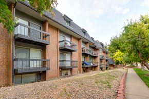 Boulder condo for rent - the outlook of the balconies of an apartment building with a sidewalk