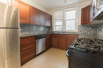Boulder apartment for rent - a kitchen with wood cabinets and stainless steel appliances