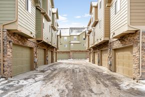 Castle Rock apartment for rent - A snowy alleyway between apartment buildings.