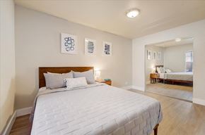 Fort Collins townhouse for rent - a bedroom with a bed and a mirror