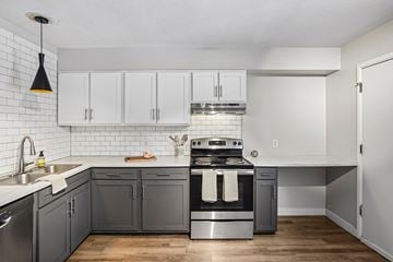 Lakewood apartment for rent - A kitchen with a stove top oven and a dishwasher.