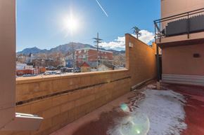 Boulder apartment for rent - a view of the city from the balcony of a building