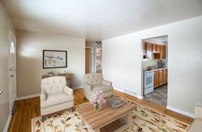 Denver apartment for rent - A living room with a couch, chair, and coffee table.