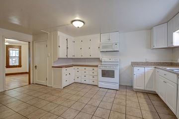 Boulder apartment for rent - A kitchen with white cabinets and appliances.
