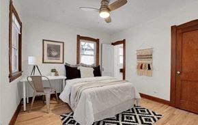 Denver apartment for rent - a bedroom with a bed and a desk