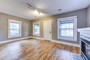 Boulder apartment for rent - A room with wooden floors and a fireplace.