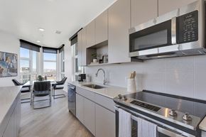 Denver apartment for rent - a kitchen with a sink and a stove and a microwave