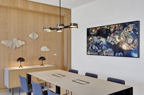 Denver apartment for rent - a conference room with a table and chairs and a painting on the wall