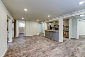 Denver apartment for rent - the living room and kitchen of a new home with a hard wood floor