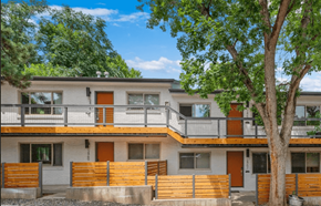Boulder apartment for rent - A modern two-story house with a balcony and orange doors.