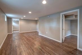 Denver apartment for rent - a renovated living room with a hard wood floor and grey walls